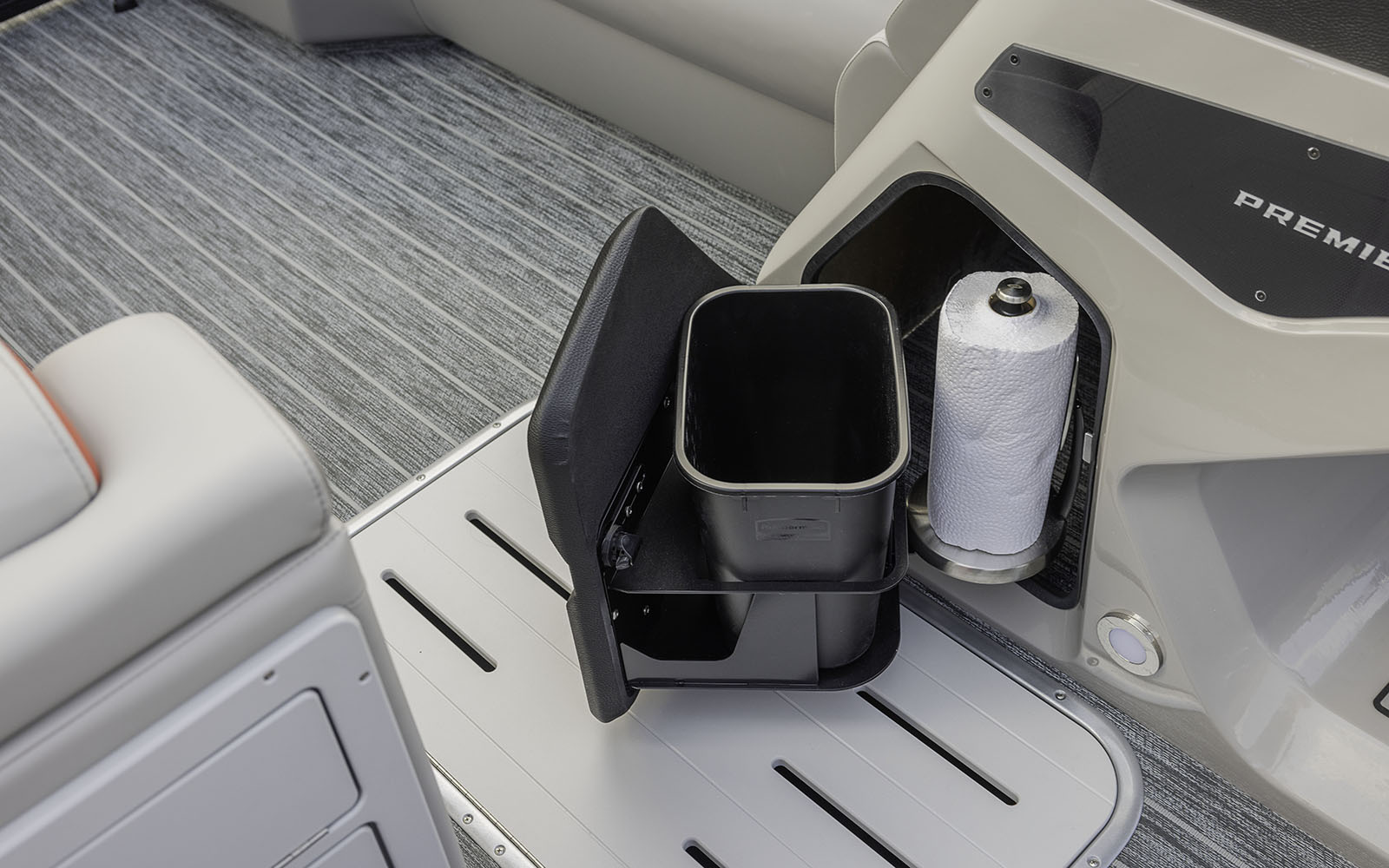 Helm storage with trash can and paper towel holder
